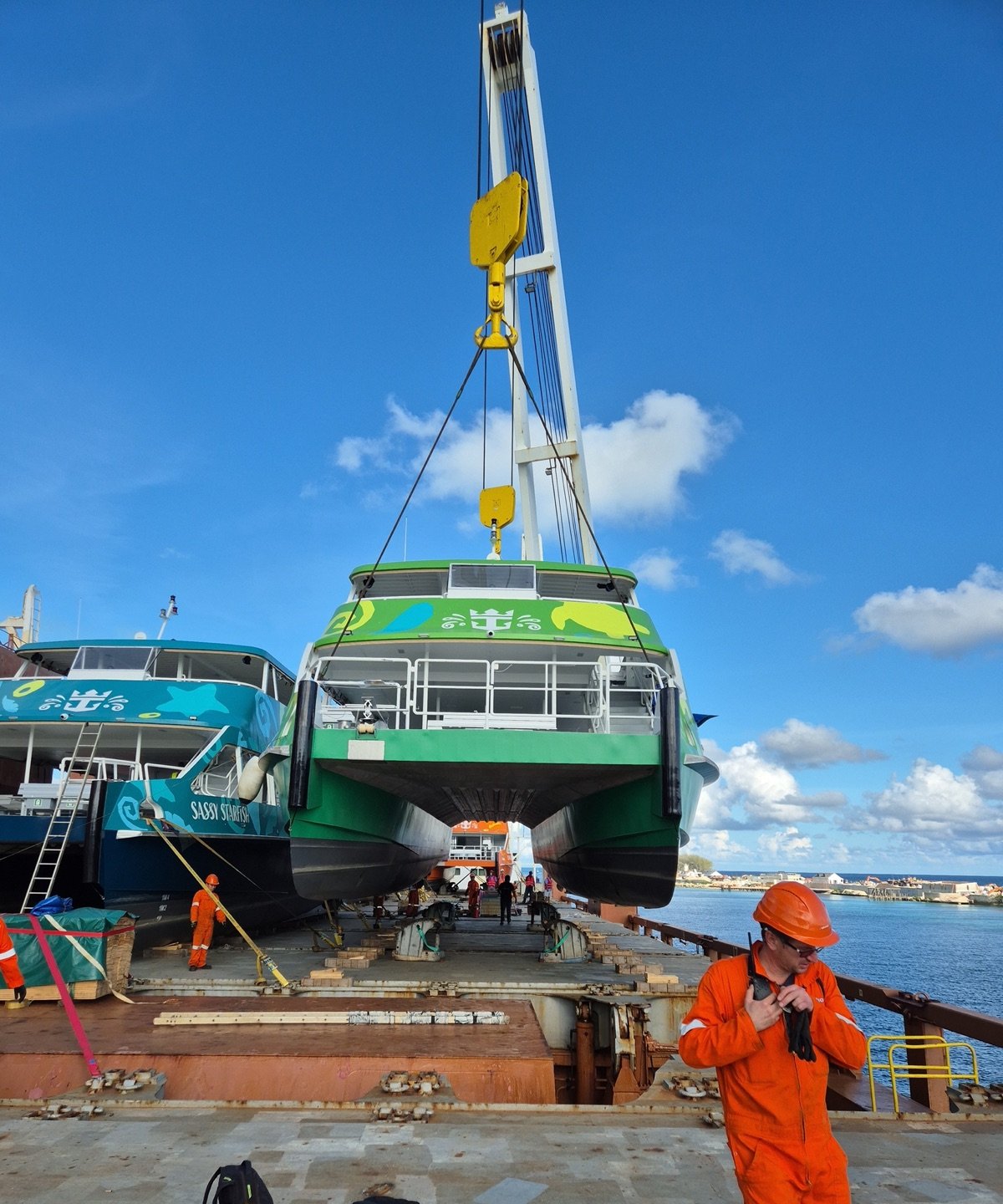 OEM Bahamas surveying the discharge of a passenger tender by crane