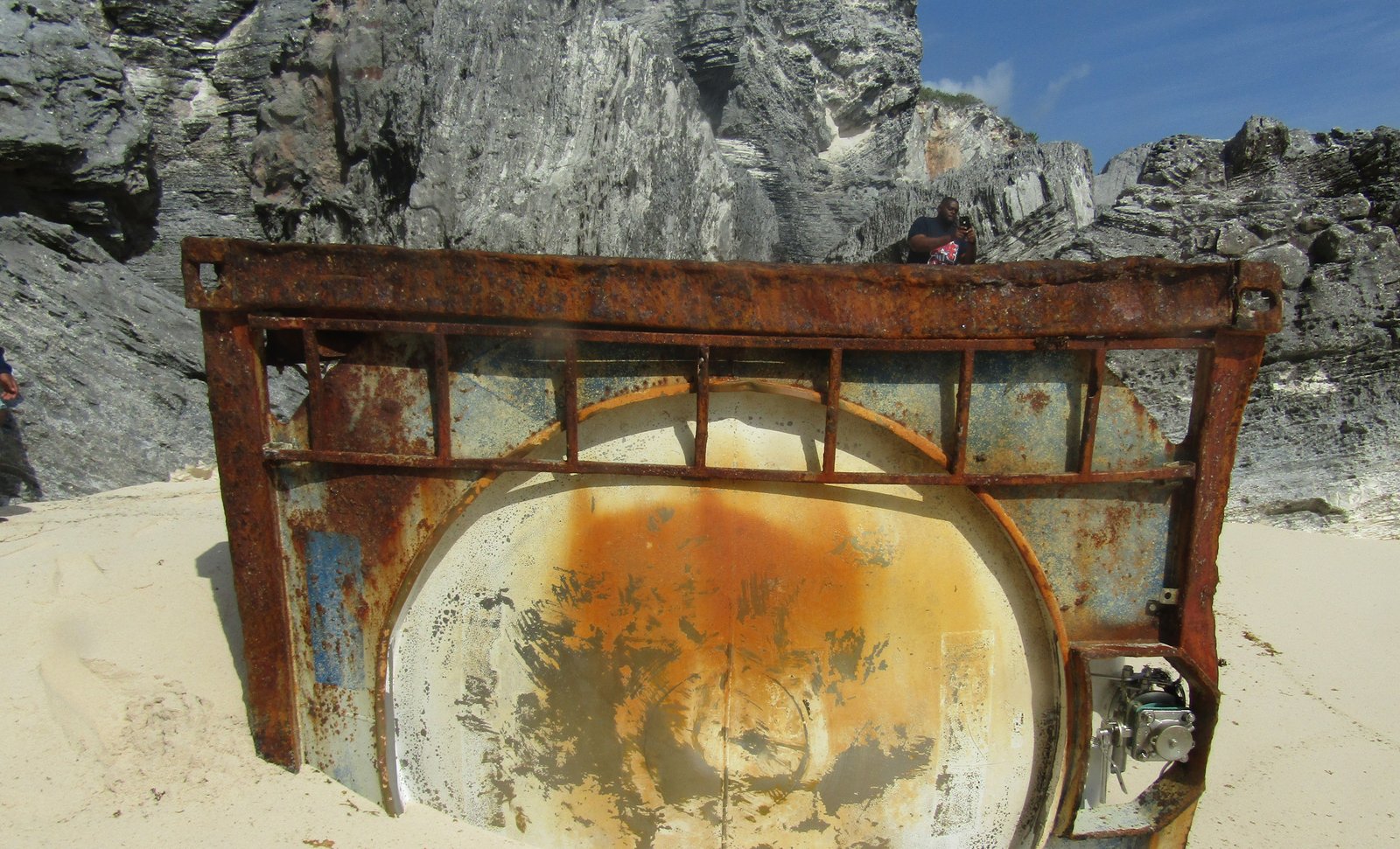 Salvaged tank cut from shoreline rock in Eleuthera