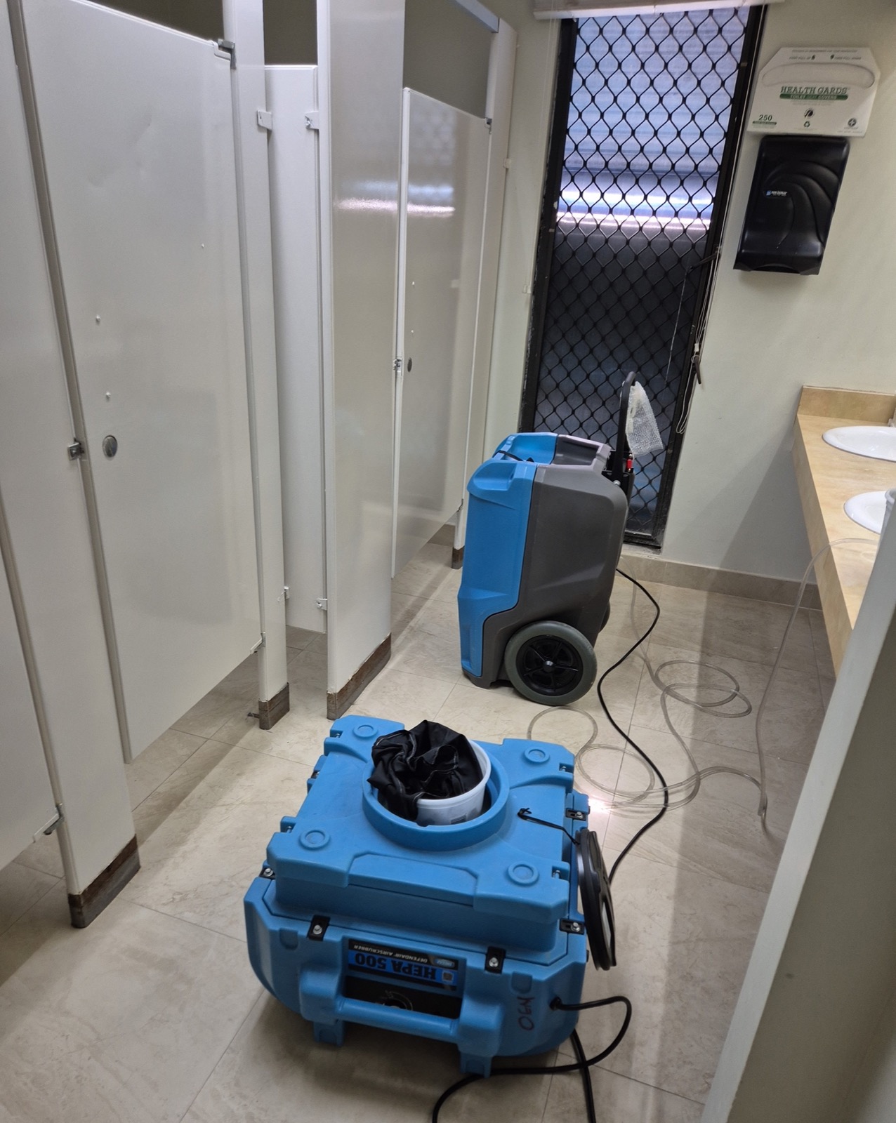 HEPA air scrubbers and dehumidifiers deployed on an OEM mold remediation job
