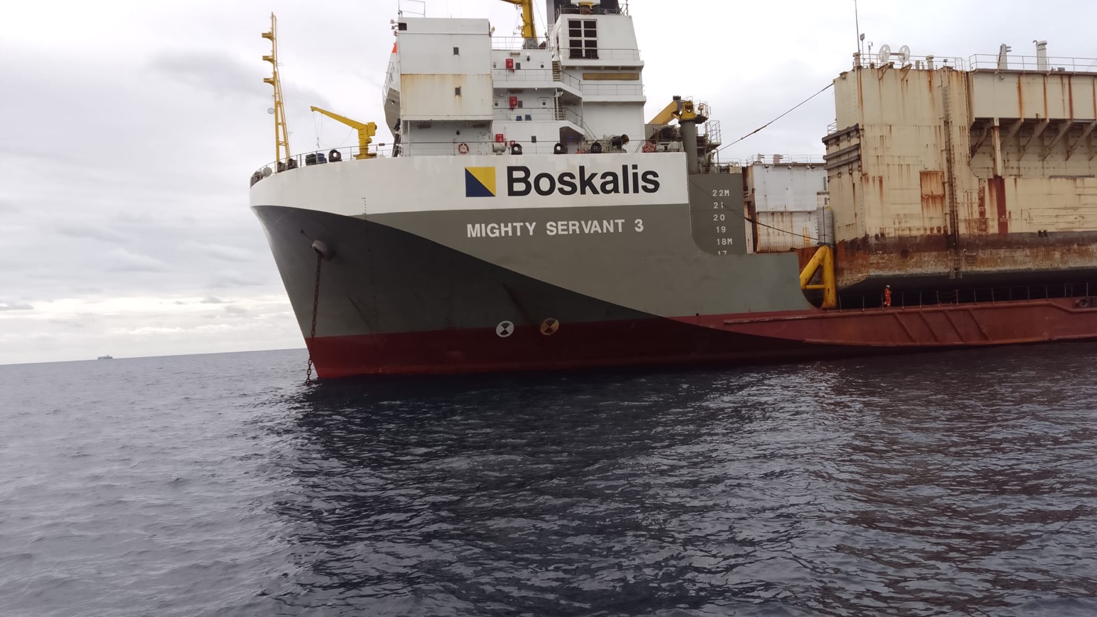 OEM surveyor approaching a vessel at open water