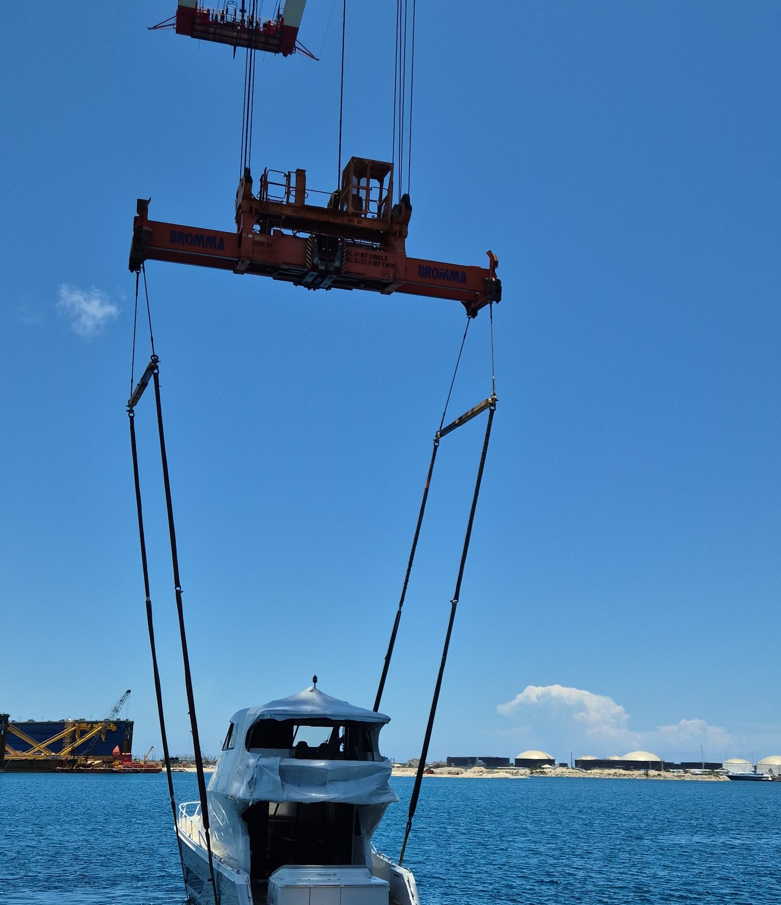 Wide view of the crane rigging during the yacht lift