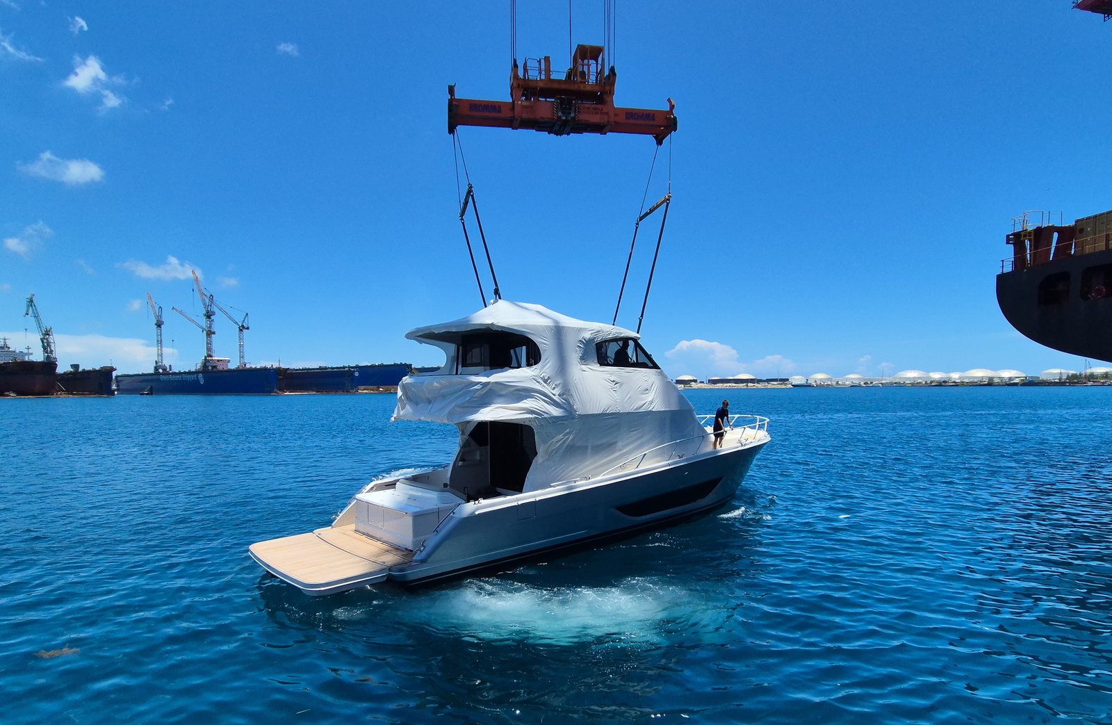 Crew member aboard the yacht during the lift