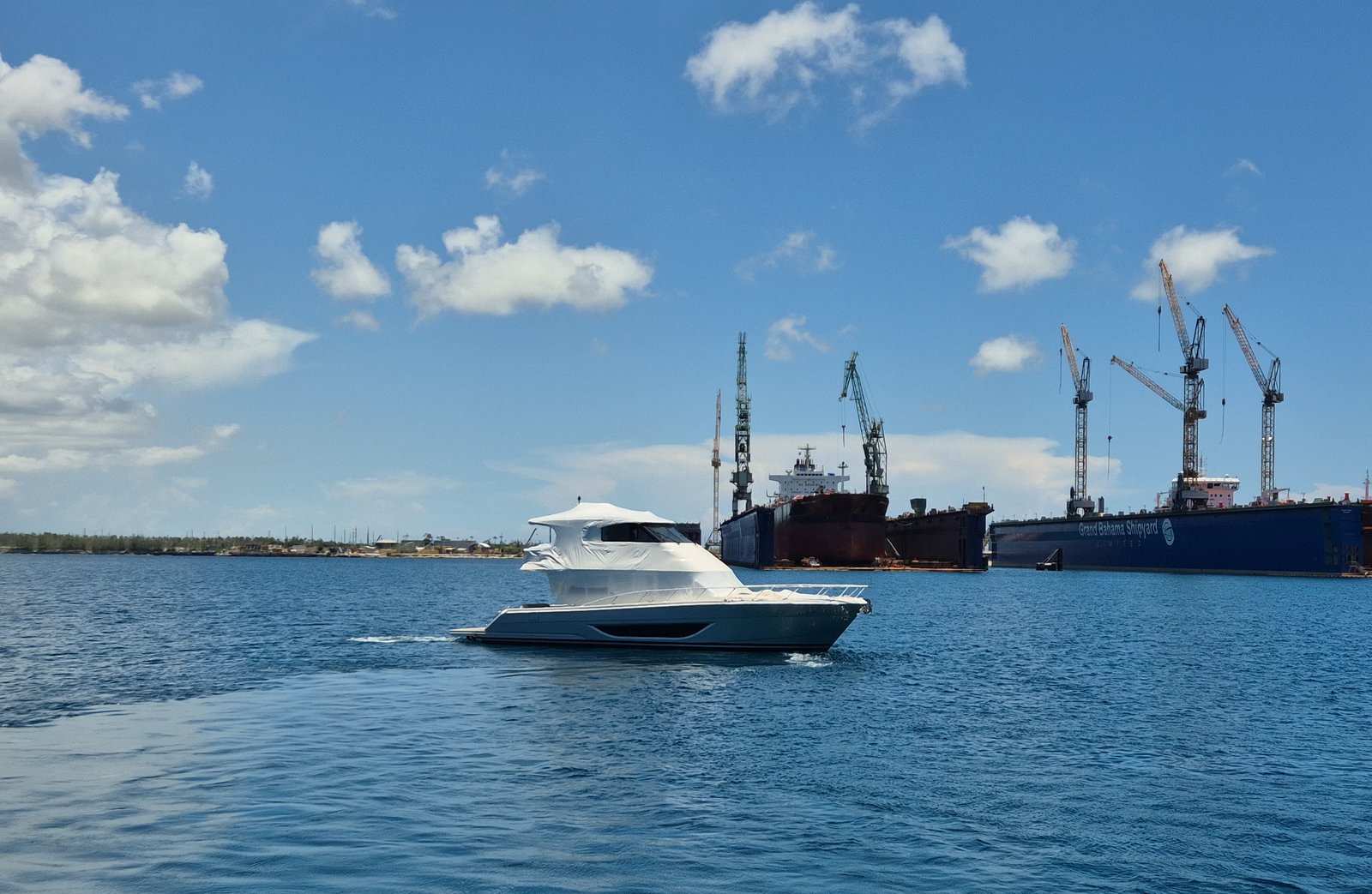 Yacht underway past the Grand Bahama Shipyard drydocks